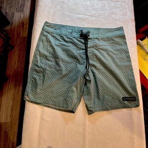 United By Blue Men’s Lace Up Shorts in Green with Grey crosses Back pocket S.36